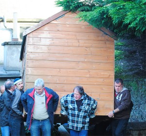 Gorey FRC's shed being carried by men